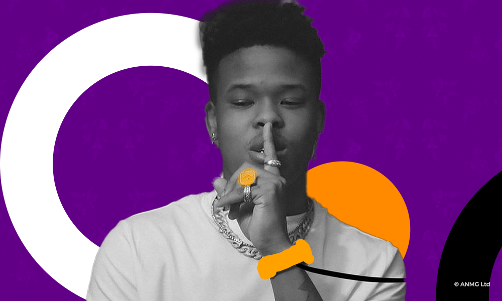 Nasty C with a finger over his lips, watch on the wrist