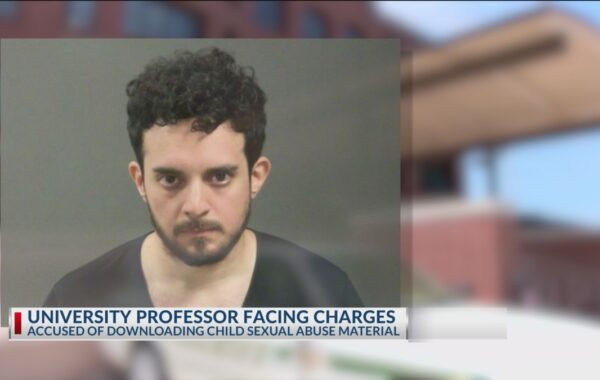 Professor to face charges